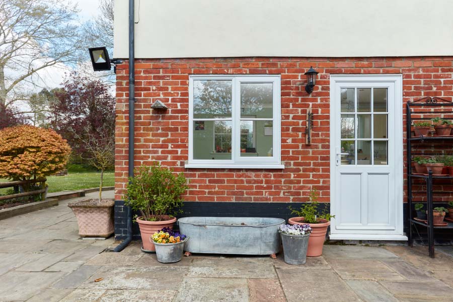 White uPVC Casement Window with White Back Door Exterior