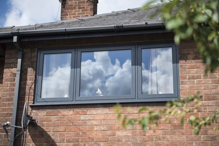 First floor flush uPVC casement window in Anthracite Grey from the Anglian flush uPVC window range