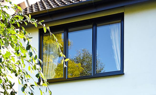 Double glazed aluminium casement window finished in Jet Black from the Anglian aluminium windows range