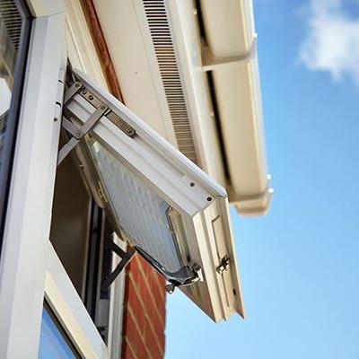 Close up of White UPVC fanlight window fully open from the Anglian window range