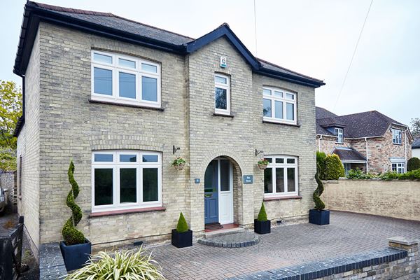 Whole house replacement double glazed UPVC casement windows in Cream from the Anglian double glazing range