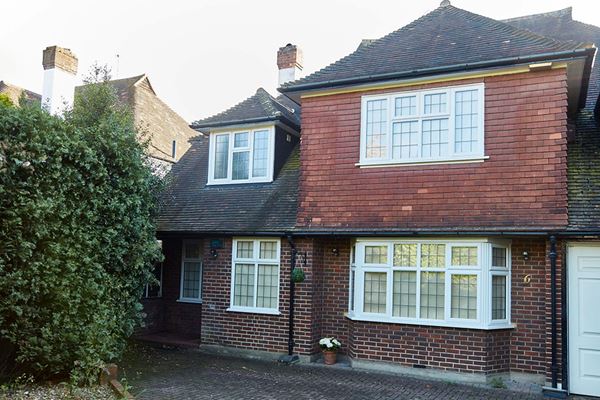 Whole house double glazing replacement of White UPVC casement windows with decorative leaded bars from Anglian Home Improvements