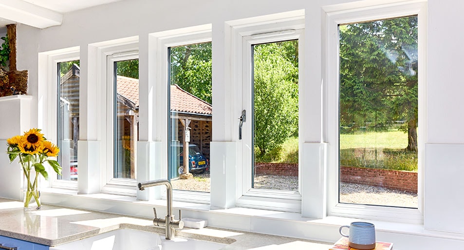 Five White Casement Windows with Chrome Handles in a Modern Kitchen