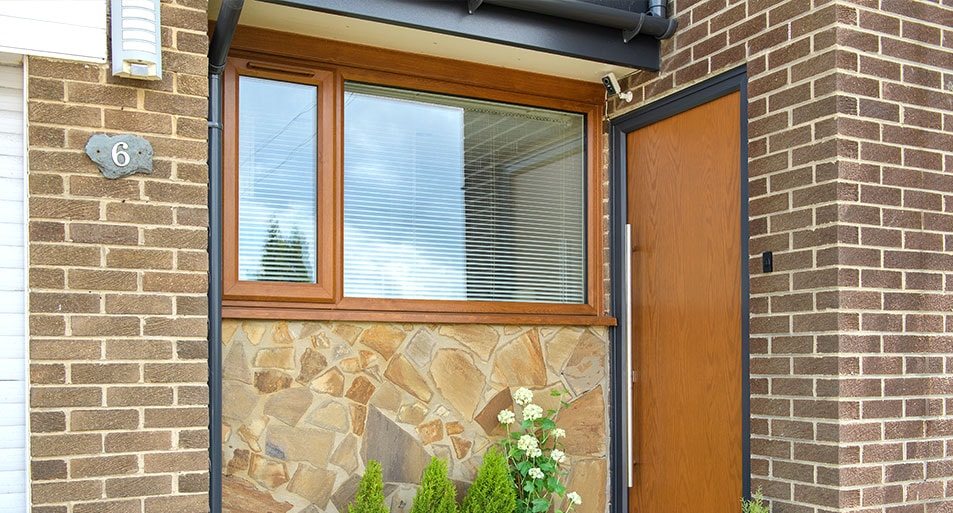 Golden Oak uPVC Triple Glazed Window with one Moving Panel and Large Fixed Panel