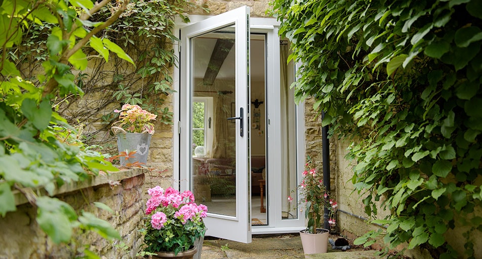 White wooden French door in open position