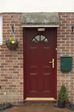 Wooden front door finished in Burgundy Red from the Anglian timber front door range