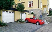 Pair of White Georgian sectional single garage doors with glazed panels