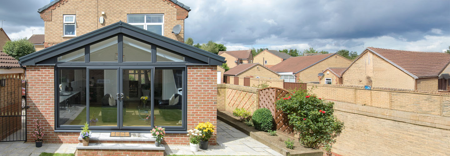 Dual anthracite grey replica tiled extension with patio doors