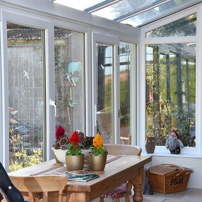 Dual sage green L shaped harmony conservatory interior