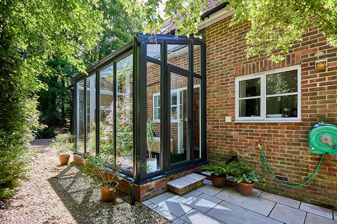Dual Anthracite grey garden room conservatory with solar glass roof