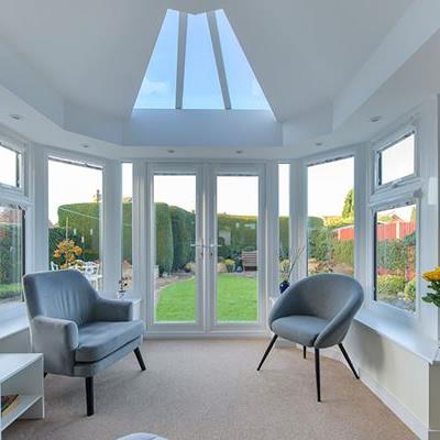White uPVC stretched Victorian conservatory with French doors interior