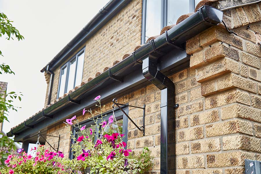 Black uPVC soffits and fascias guttering with casement windows