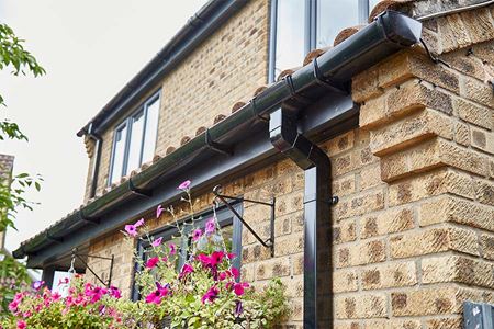 Black uPVC soffits and fascias guttering with casement windows