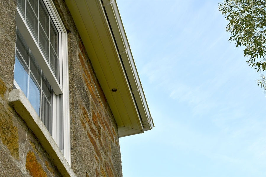 White uPVC soffit and fascias with sash windows