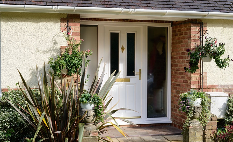 White uPVC guttering and soffits above front door from the Anglian rooftrim range