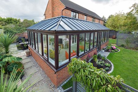 Dual dark woodgrain uPVC tilt and turn windows